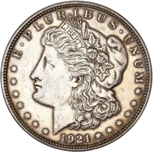 Tête de l'allégorie de la Liberté tournée à gauche et portant le bonnet phrygien, un ruban marqué LIBERTY et une couronne végétale.