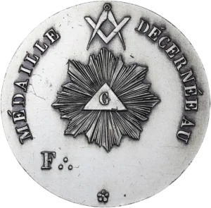 Un G dans un triangle rayonnant sous l’équerre et le compas entrecroisés.