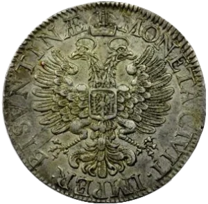 Aigle bicéphale impérial nimbé sous une couronne, décoré d’un écu aux armes de Besançon.