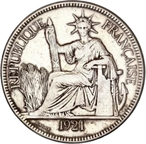 La république couronnée et drapée, assise à gauche, tenant un faisceau et s'appuyant sur un gouvernail et une ancre marine. A l'arrière un paysage de rizière.