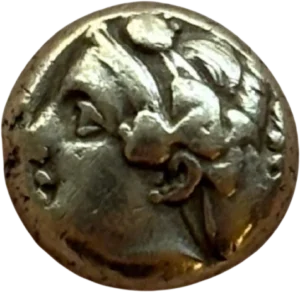 Tête de Démeter à droite coiffée de la couronne d'épis.