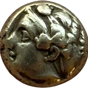 Tête de Démeter à droite coiffée de la couronne d'épis.