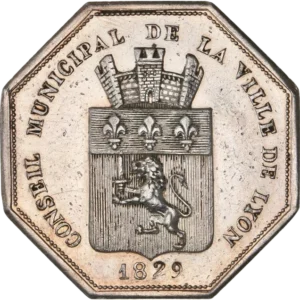 Blason à attribution entouré couronne végétale.