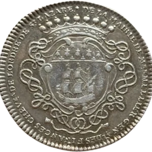 Écu rond timbré d’une couronne de marquis, posé sur une croix de Saint-Lazare et entouré du collier de l’ordre.