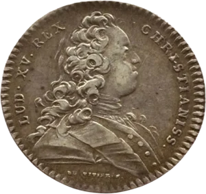 Buste habillé du roi jeune à droite.