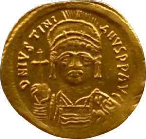 Buste diadémé, couronné et cuirassé de Justinien Ier de face, tenant le globe crucigère de la main droite et un bouclier orné.