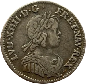 Buste lauré de Louis XIV à droite.