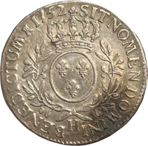 Tête laurée de Louis XV à gauche.