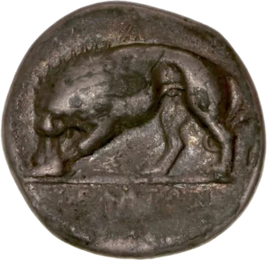 Lion mangeant une proie à gauche.