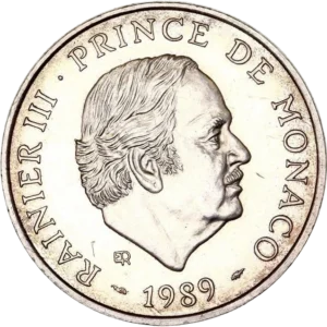 Tête nue du prince Rainier III à droite.