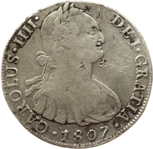 Buste lauré et cuirassé de Carlos IV à droite.