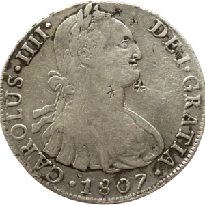 Buste lauré et cuirassé de Carlos IV à droite.