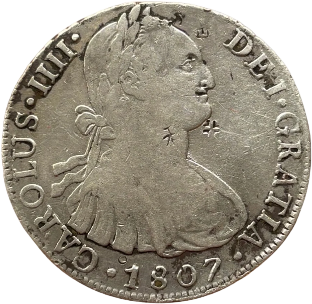 Armoiries du royaume d'Espagne, couronnées, entourées par deux piliers.