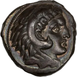 Anépigraphe. Tête de Melqart-Héraclès à droite, coiffée de la peau de lion.