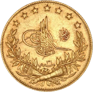 Toughra, accostée à droite au-dessus d'une couronne avec deux carquois entrecroisés.